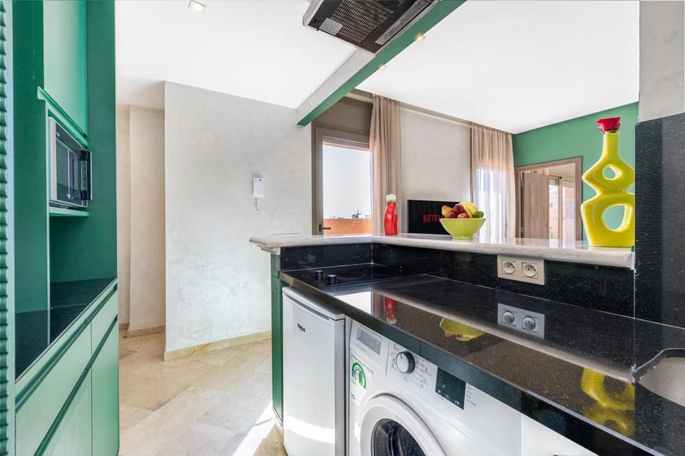 Kitchen or kitchenette, oven, stove, washing machine
