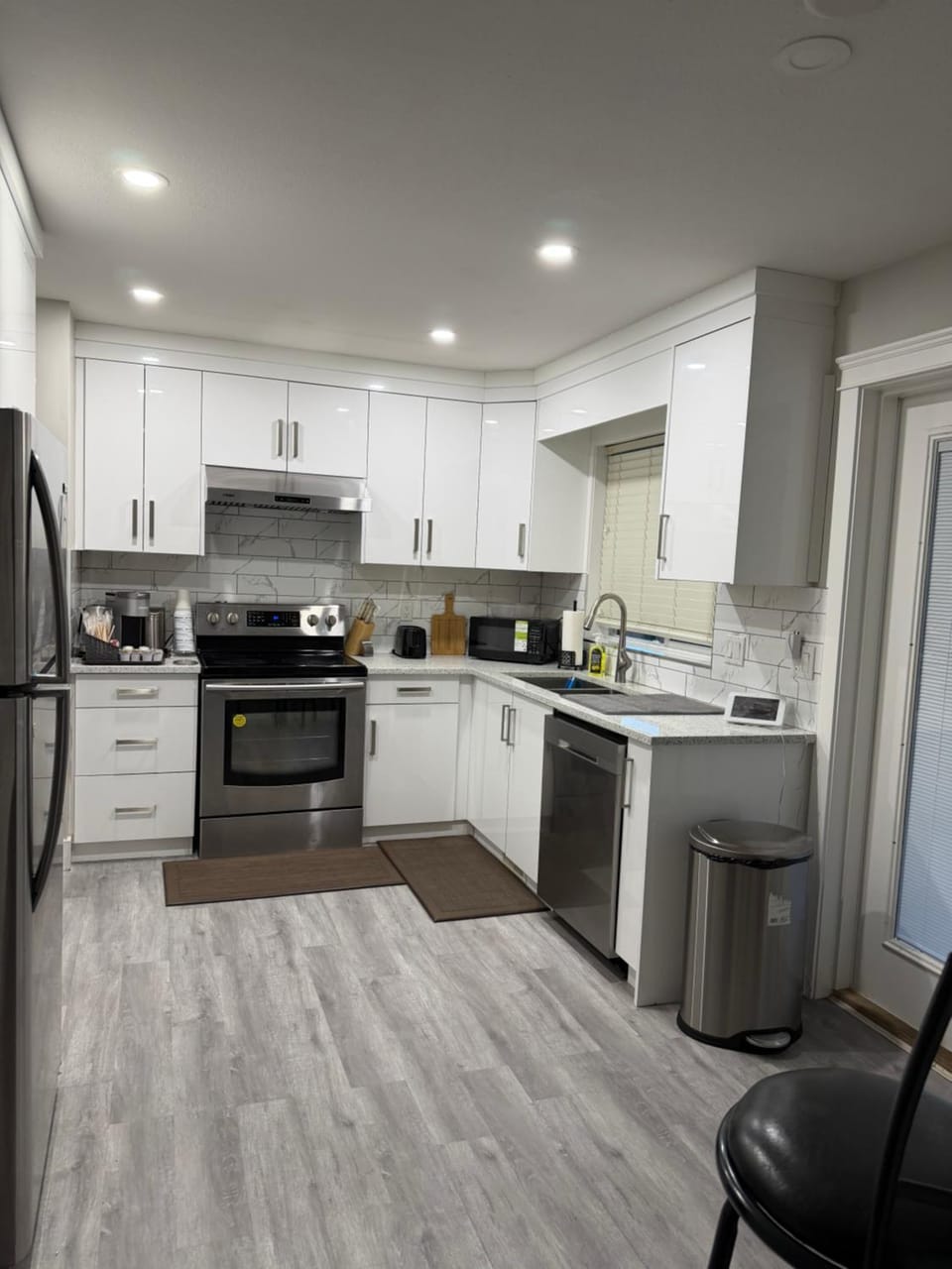 Kitchen or kitchenette, dishwasher, oven, stove, toaster