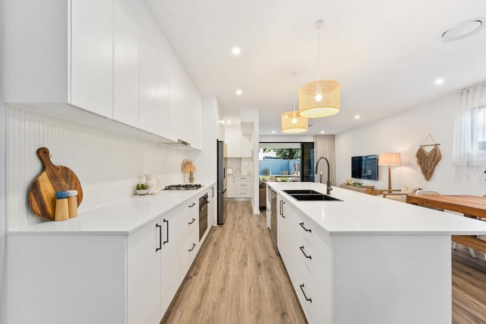 Kitchen or kitchenette, dishwasher, oven, stove