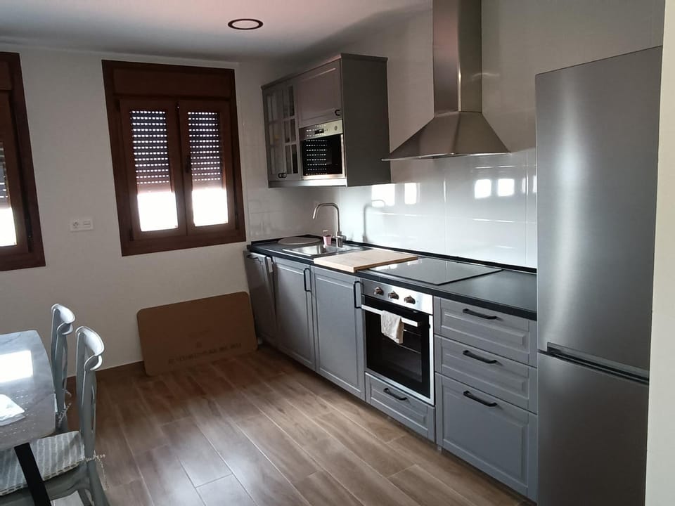 Kitchen or kitchenette, dishwasher, oven, stove