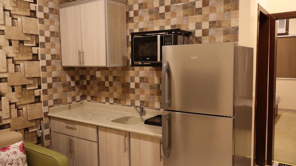 Kitchen or kitchenette, microwave