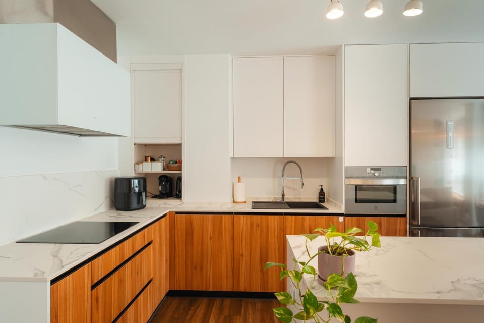 Kitchen or kitchenette, dishwasher, oven, stove, toaster