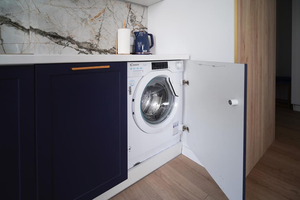 Kitchen or kitchenette, washing machine