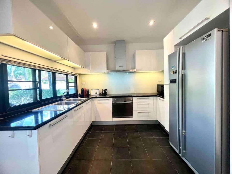 Kitchen or kitchenette, dishwasher, oven, stove
