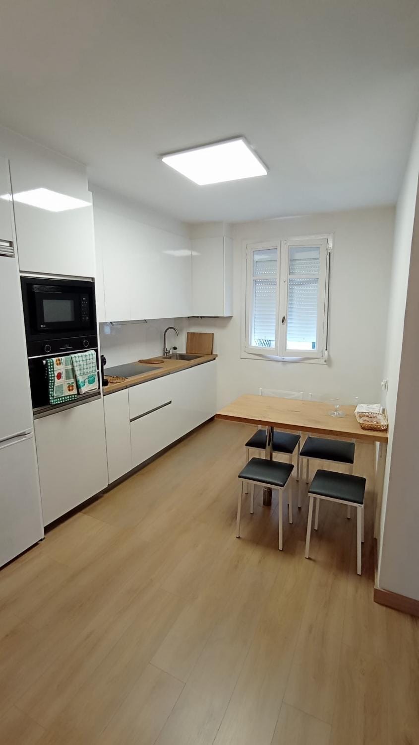 Kitchen or kitchenette, microwave, oven, stove