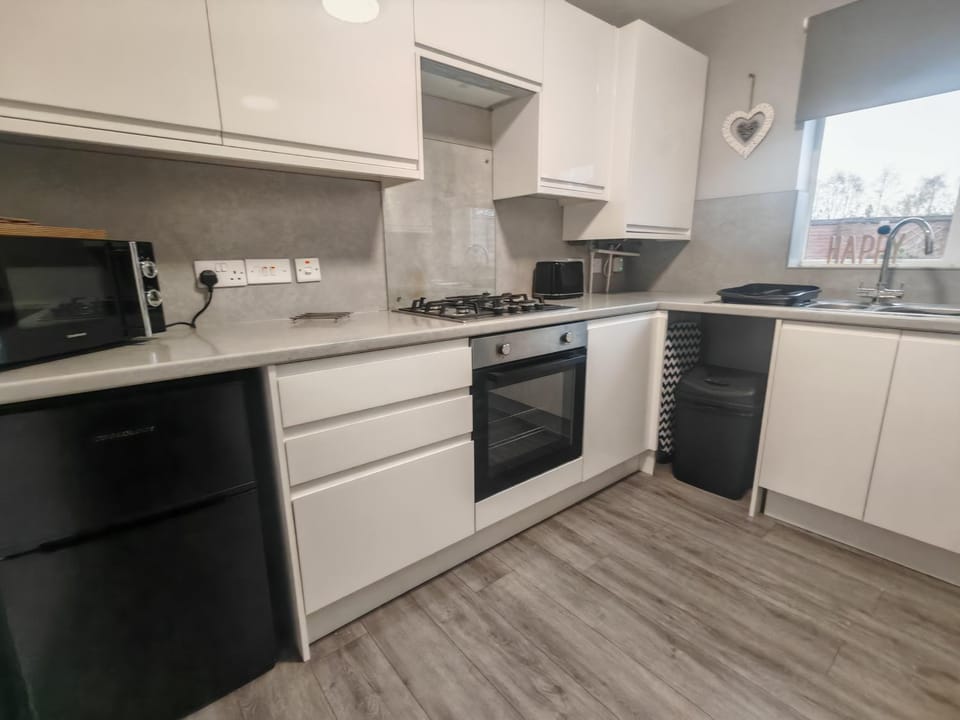 Kitchen or kitchenette, oven, stove, toaster