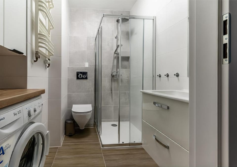 Shower, Toilet, Bathroom, towels, washing machine, dryer