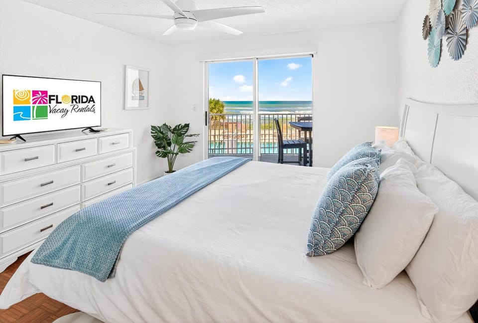 Ground floor direct oceanfront 2/2 with a balcony, heated pool, and garage parking Apartment in Ormond By The Sea