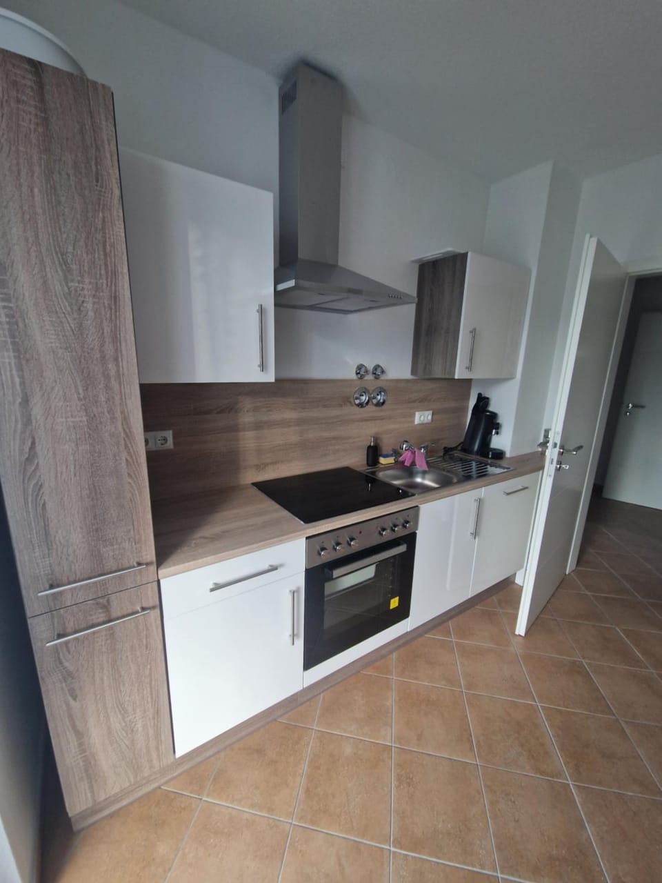 Kitchen or kitchenette, dishwasher, oven, stove