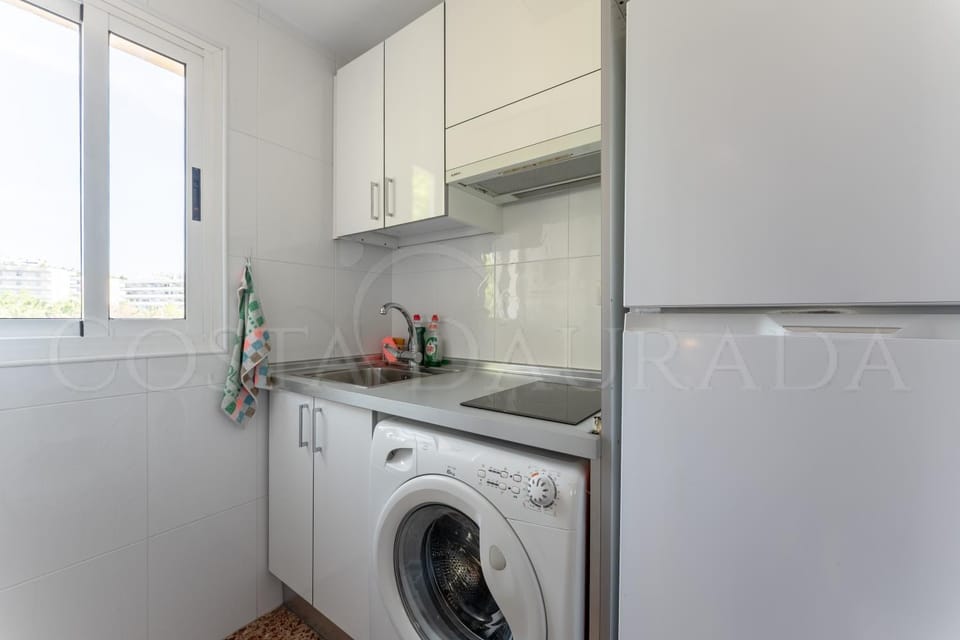 Kitchen or kitchenette, washing machine
