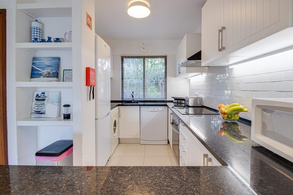 Kitchen or kitchenette, dishwasher, oven, stove, toaster