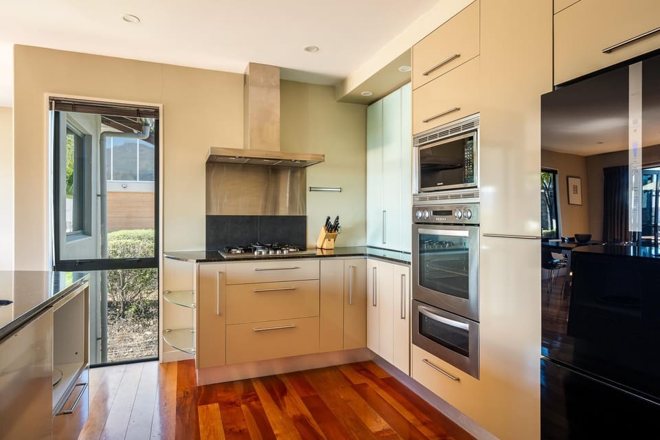 Kitchen or kitchenette, dishwasher, oven, stove