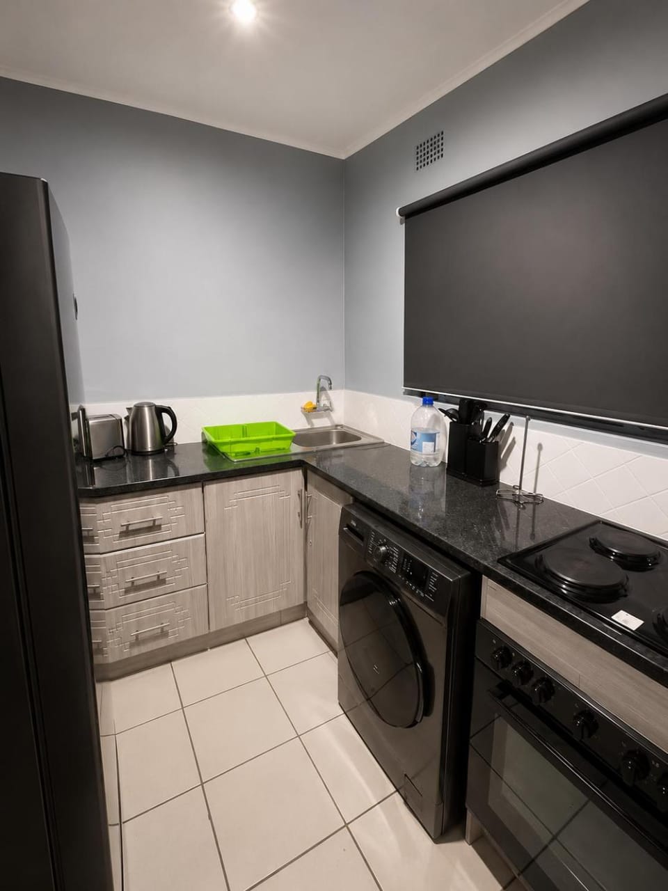 Kitchen or kitchenette, oven, stove, toaster, washing machine