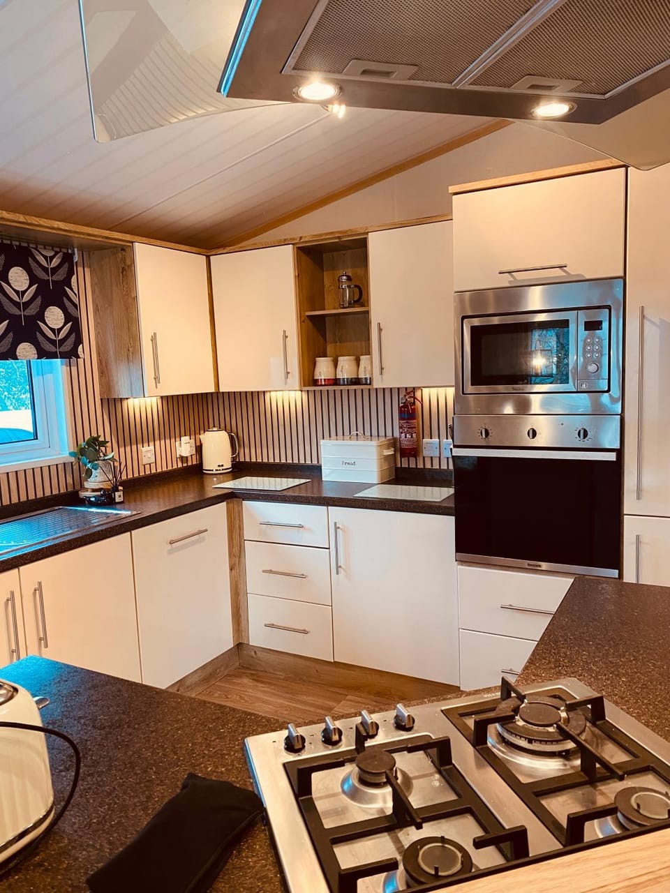 Kitchen or kitchenette, dishwasher, oven, stove