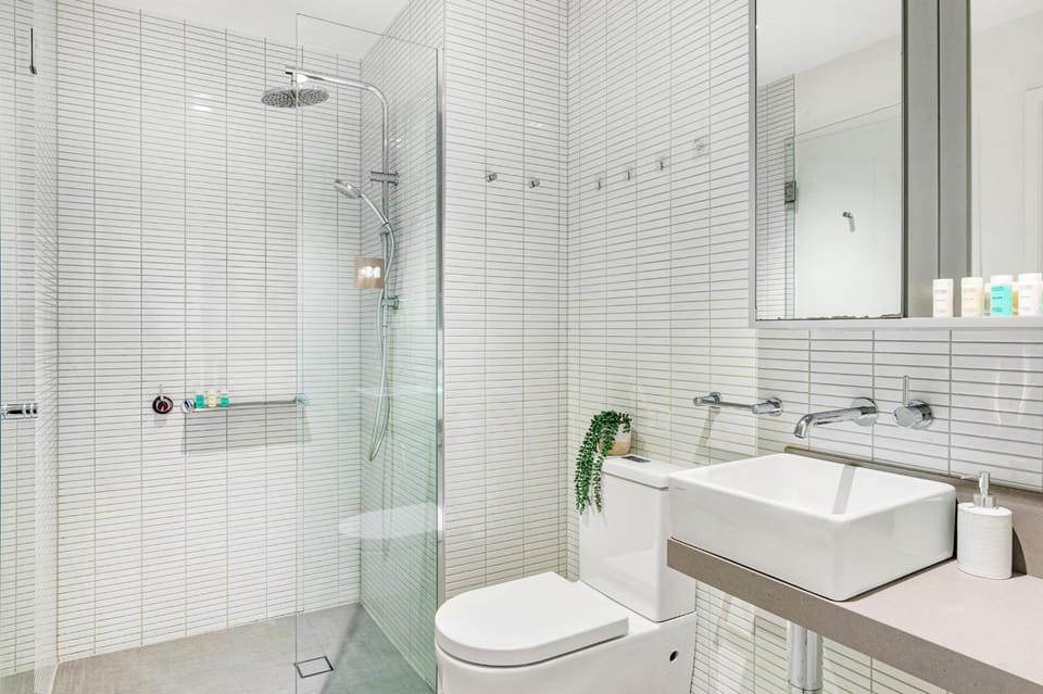 Shower, Toilet, Bathroom, flat iron, hair dryier, internet, towels, laundry, washing machine, dryer