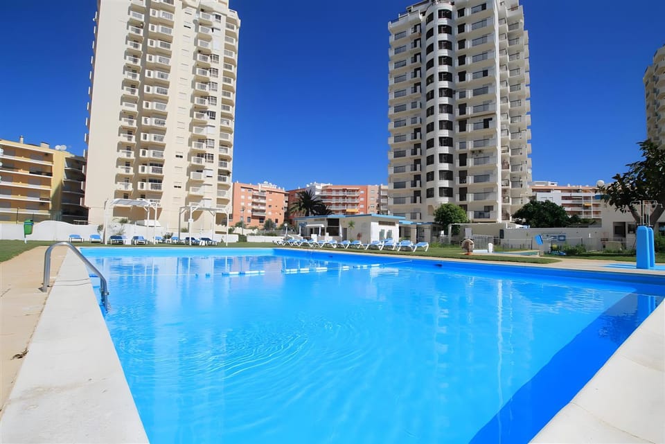 Property building, Living room, Swimming pool