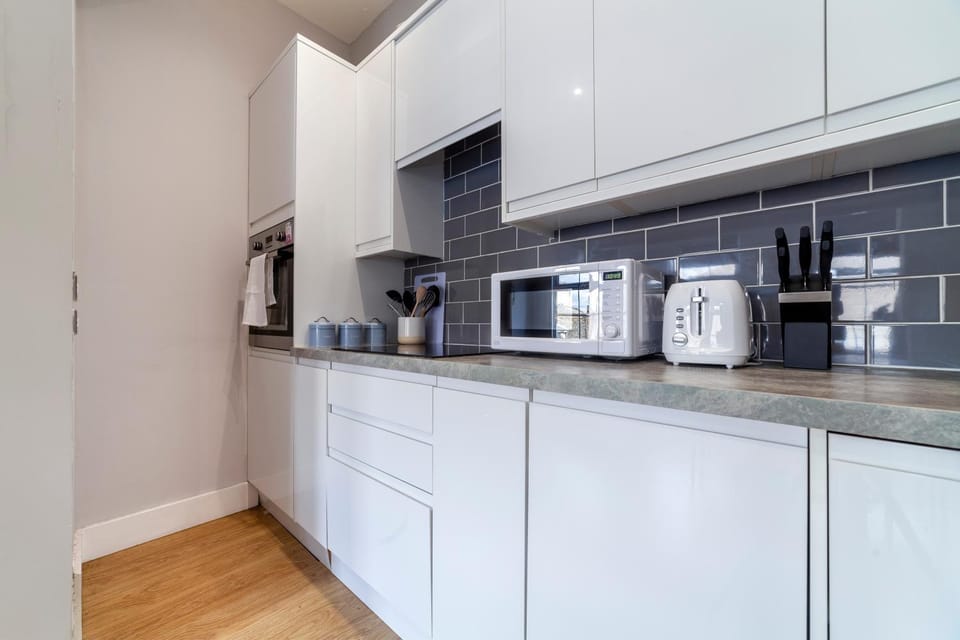 Kitchen or kitchenette, microwave, oven, stove, toaster, kitchen