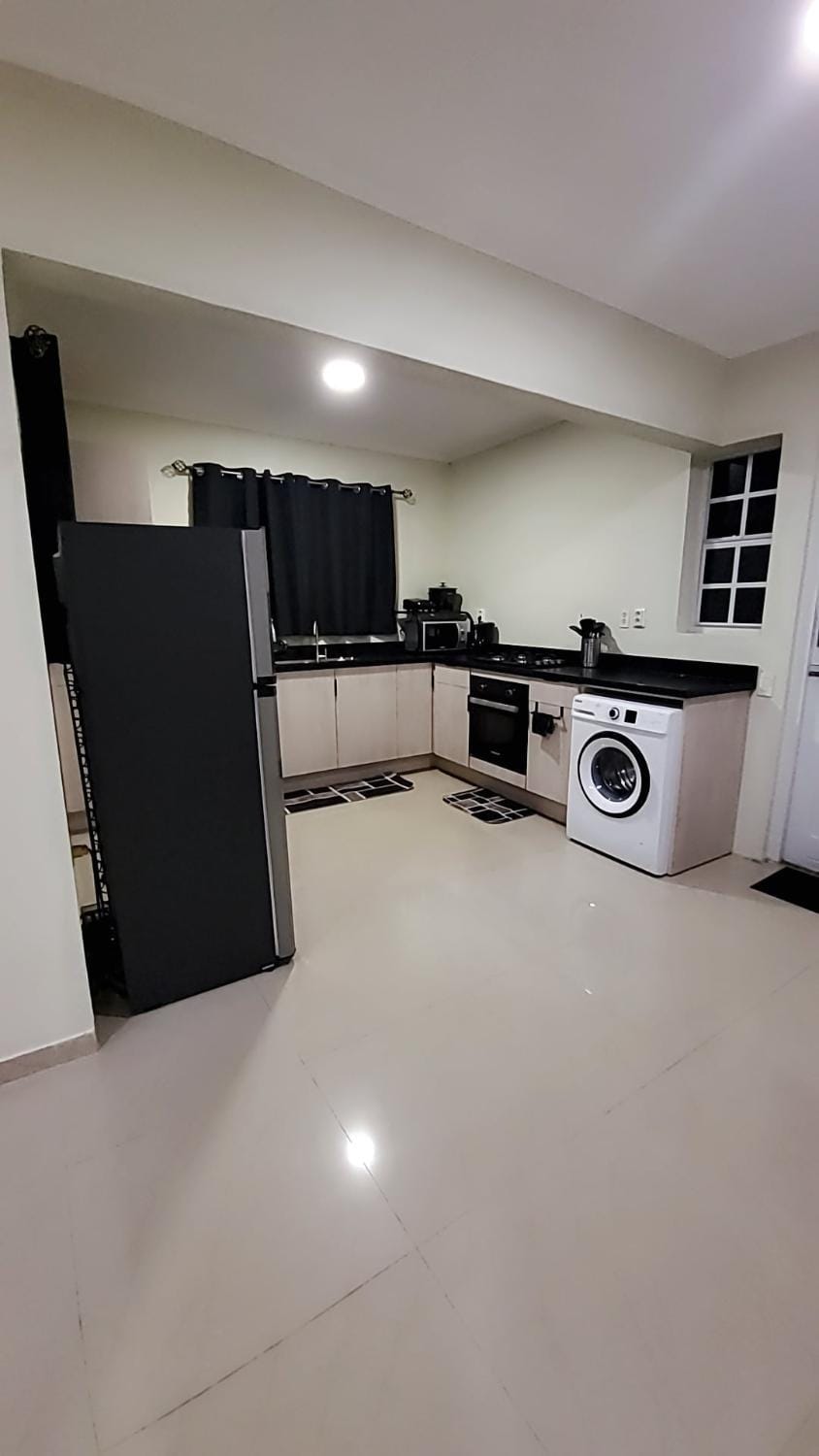 Kitchen or kitchenette, washing machine