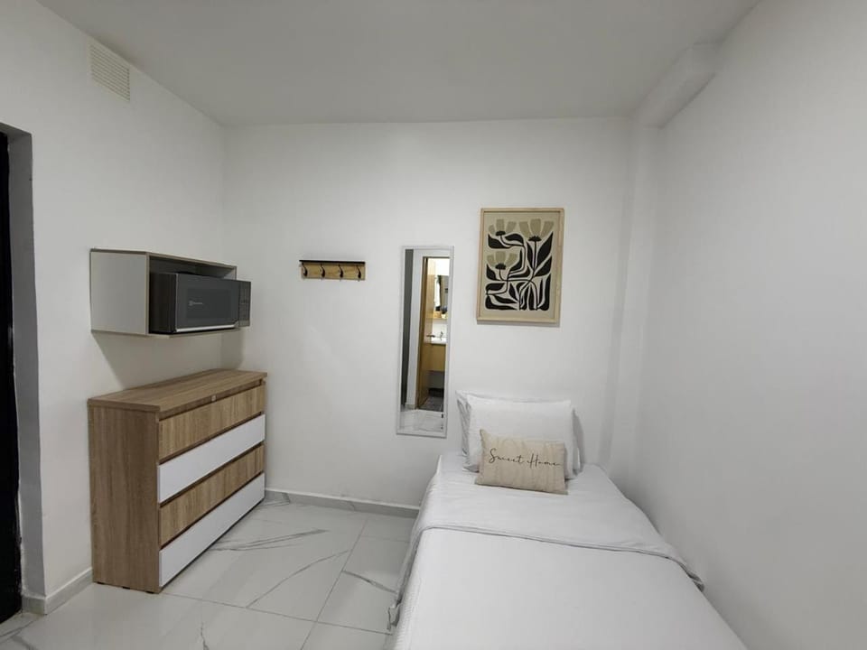Bed, Bedroom, hair dryier, microwave