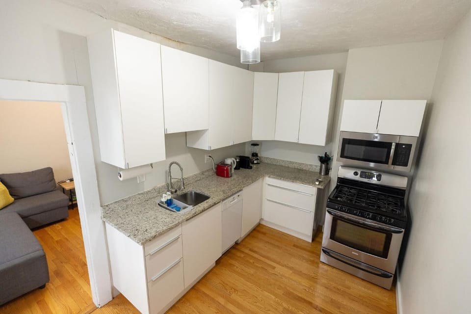 Kitchen or kitchenette, dishwasher, oven, stove, toaster