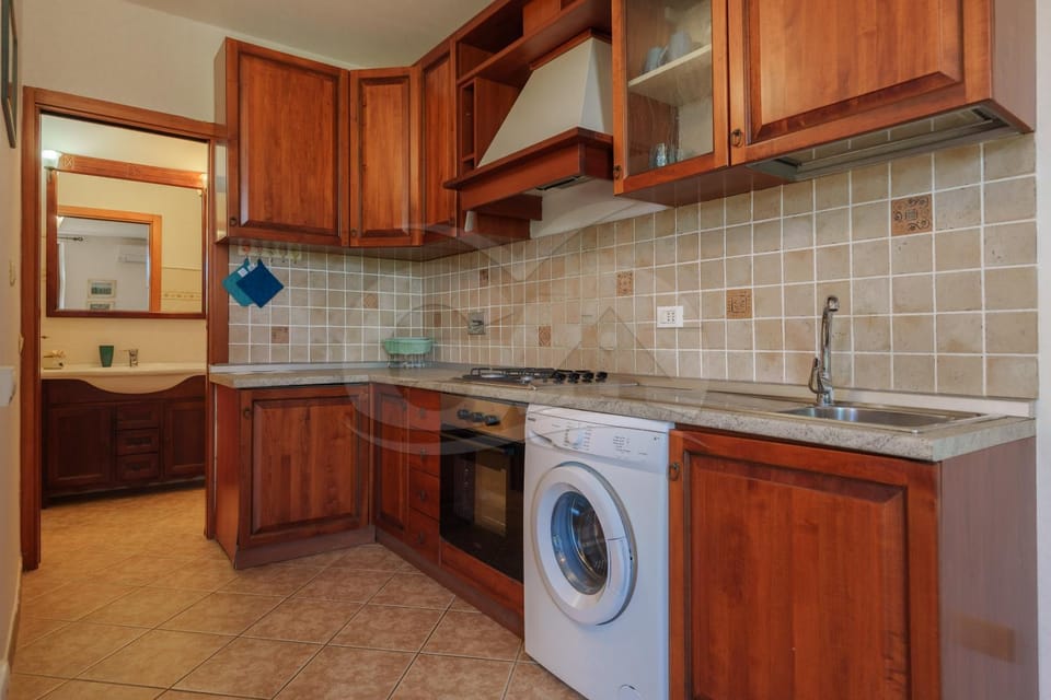 Kitchen or kitchenette, washing machine