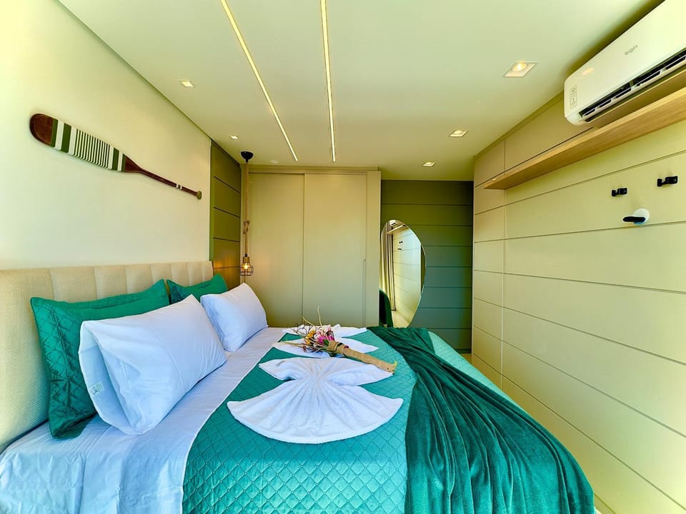 Photo of the whole room, towels, wardrobe, air conditioner