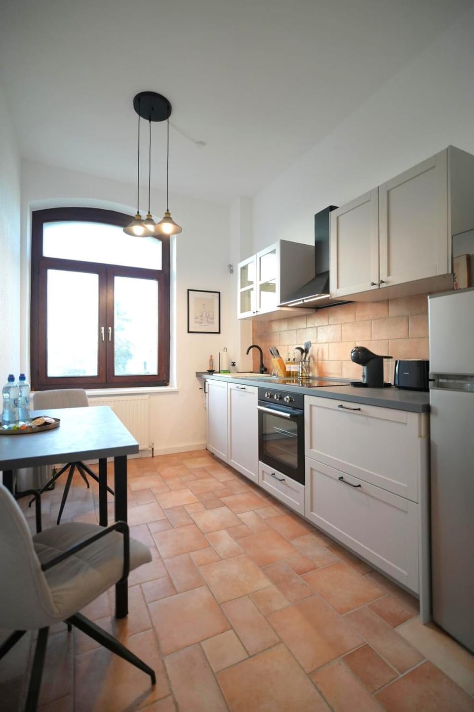 Kitchen or kitchenette, dishwasher, oven, stove