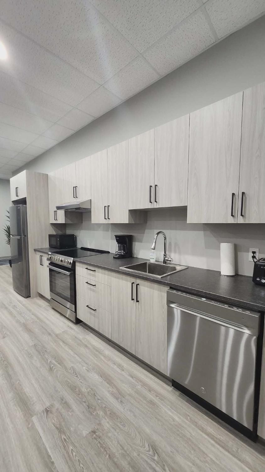Kitchen or kitchenette, dishwasher, oven, stove, toaster