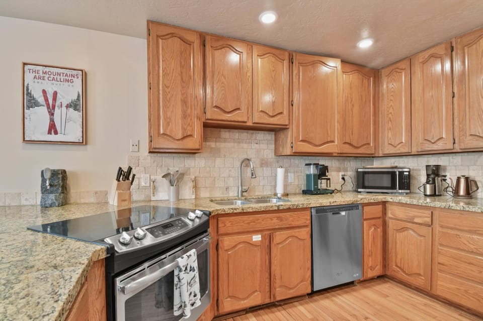 Kitchen or kitchenette, furniture, microwave, stove