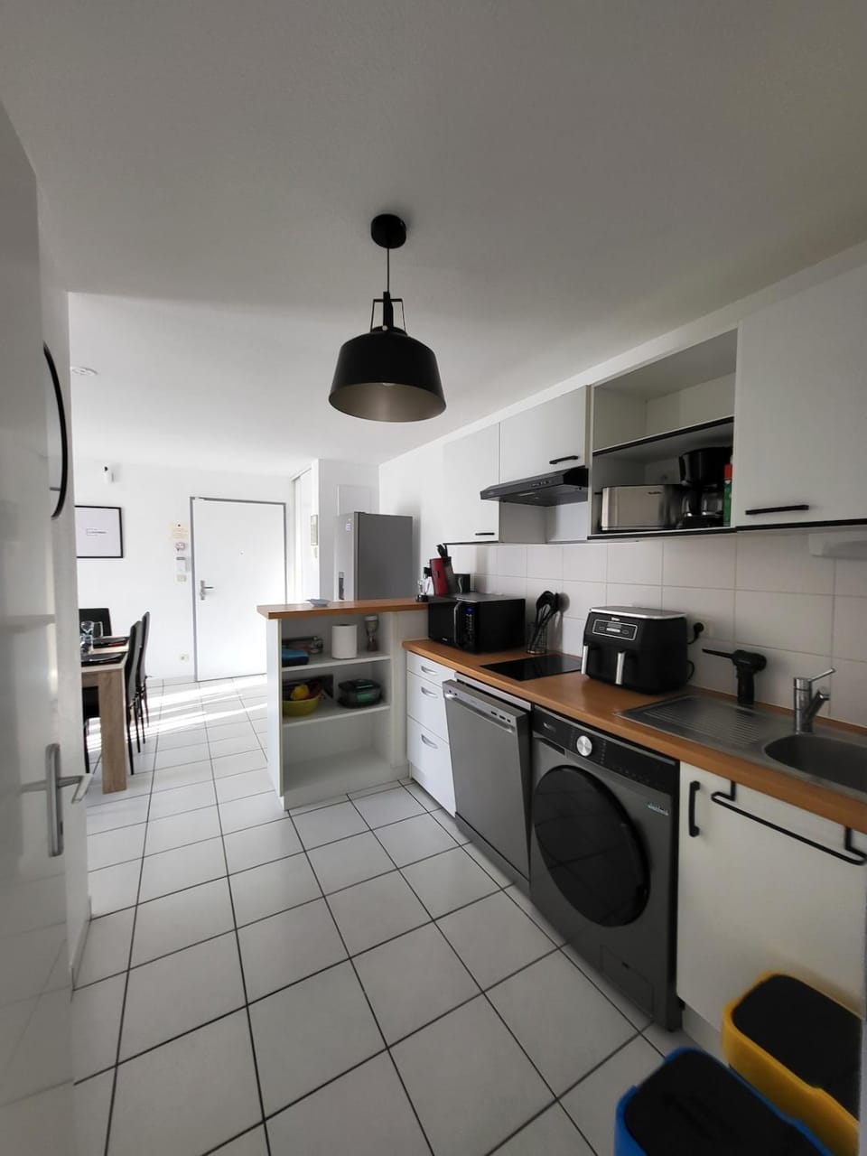 Kitchen or kitchenette, dishwasher, stove, toaster, washing machine