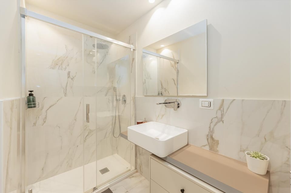 Shower, Bathroom, hair dryier, towels, washing machine