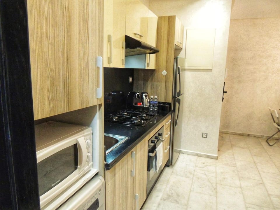 Kitchen or kitchenette, microwave, oven, stove, washing machine