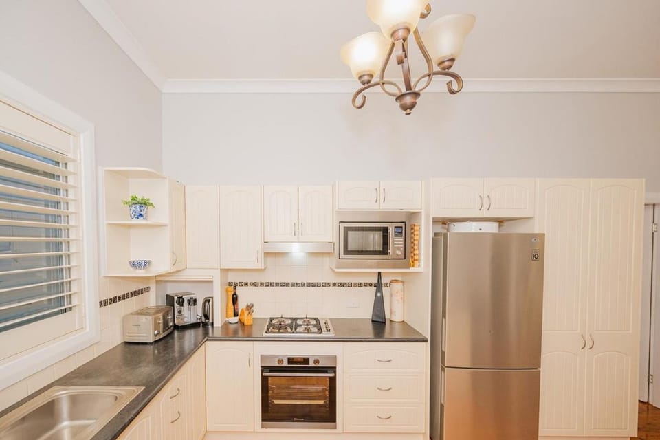 Kitchen or kitchenette, microwave, oven, stove, toaster
