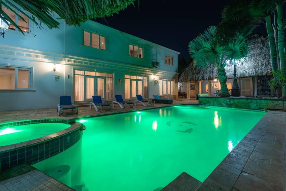 Property building, Patio, Night, Pool view, Swimming pool, sunbed
