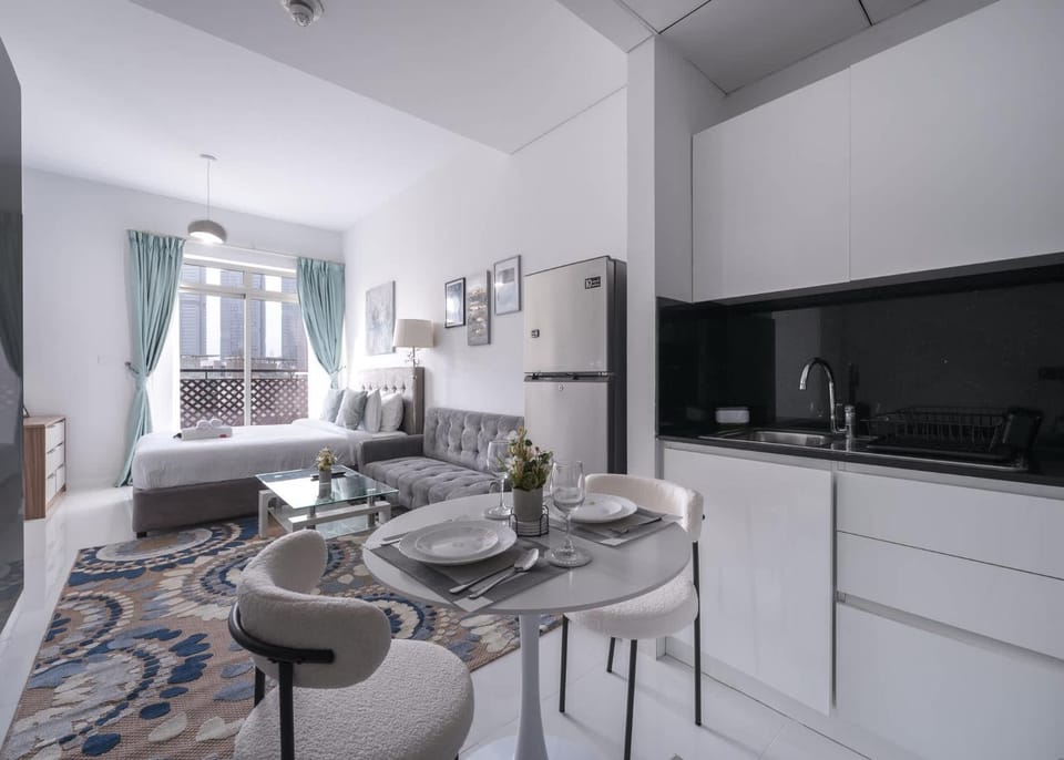 Free housekeeping visits during your stay - StayShort - Elegant JVC Studio Sleeps 4 with Private Balcony Apartment in Dubai