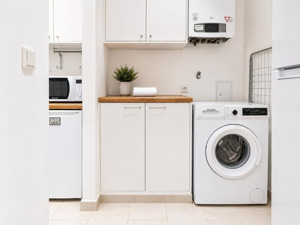 Kitchen or kitchenette, dishwasher, oven, stove, washing machine
