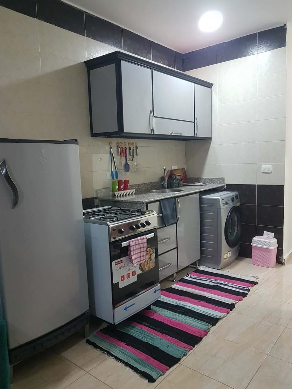 Kitchen or kitchenette, dishwasher, oven, stove, washing machine, dryer