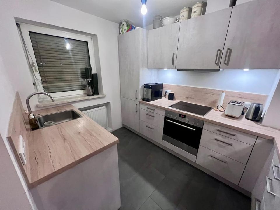 Kitchen or kitchenette, dishwasher, oven, stove, toaster