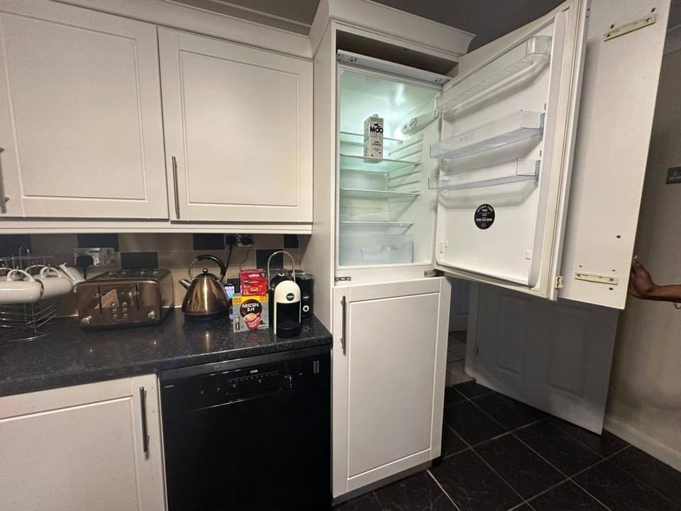 Kitchen or kitchenette, dishwasher, oven, stove