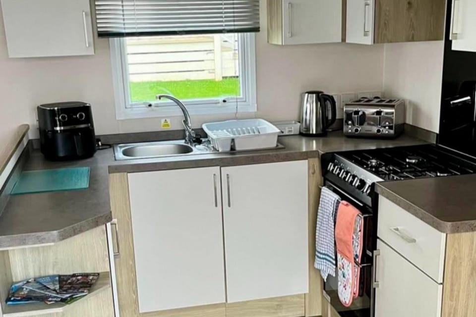 Kitchen or kitchenette, oven, stove, toaster