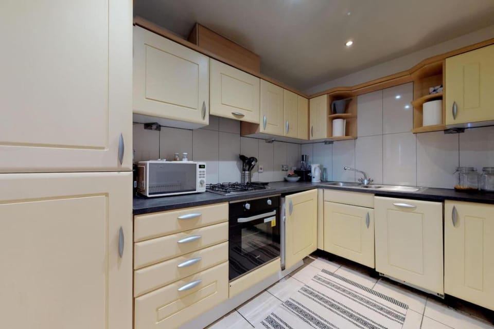 Kitchen or kitchenette, dishwasher, oven, stove, toaster