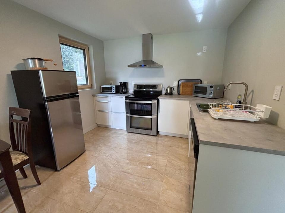 Kitchen or kitchenette, dishwasher, oven, stove, toaster