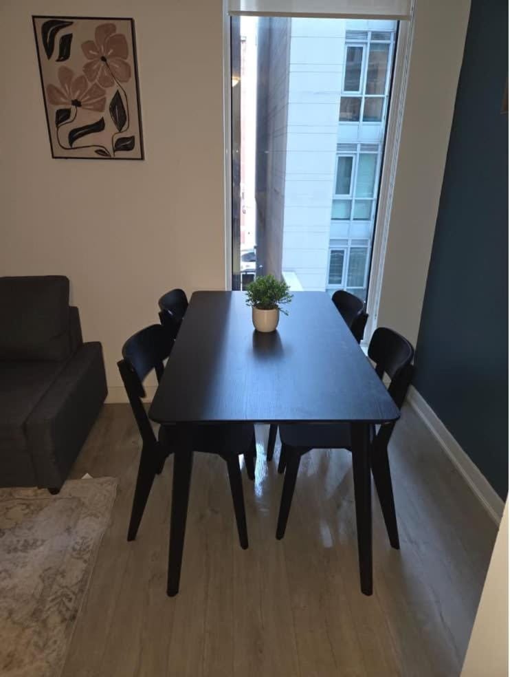 Condo with grey sofa bed Apartment in Port Hope