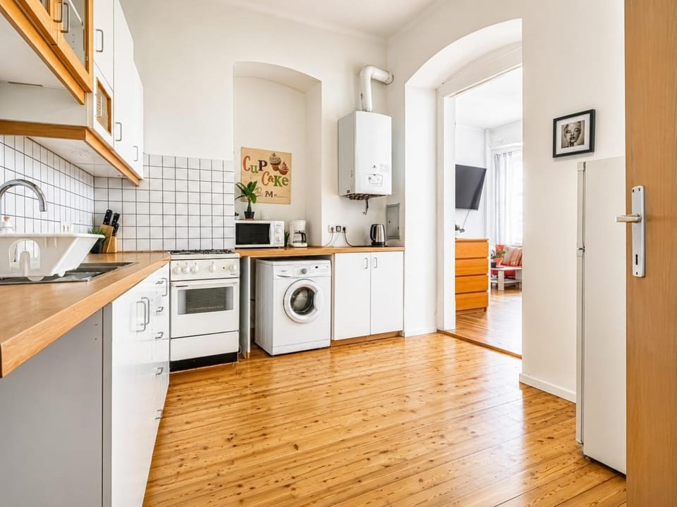 Kitchen or kitchenette, oven, stove, toaster, washing machine