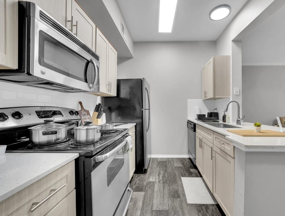Kitchen or kitchenette, dishwasher, oven, stove, toaster