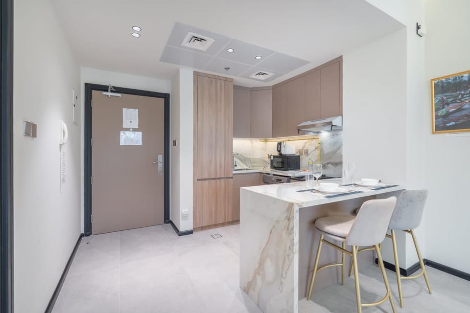 Free housekeeping visits during your stay - StayShort - Chic Studio Near Miracle Garden with Patio Apartment in Dubai