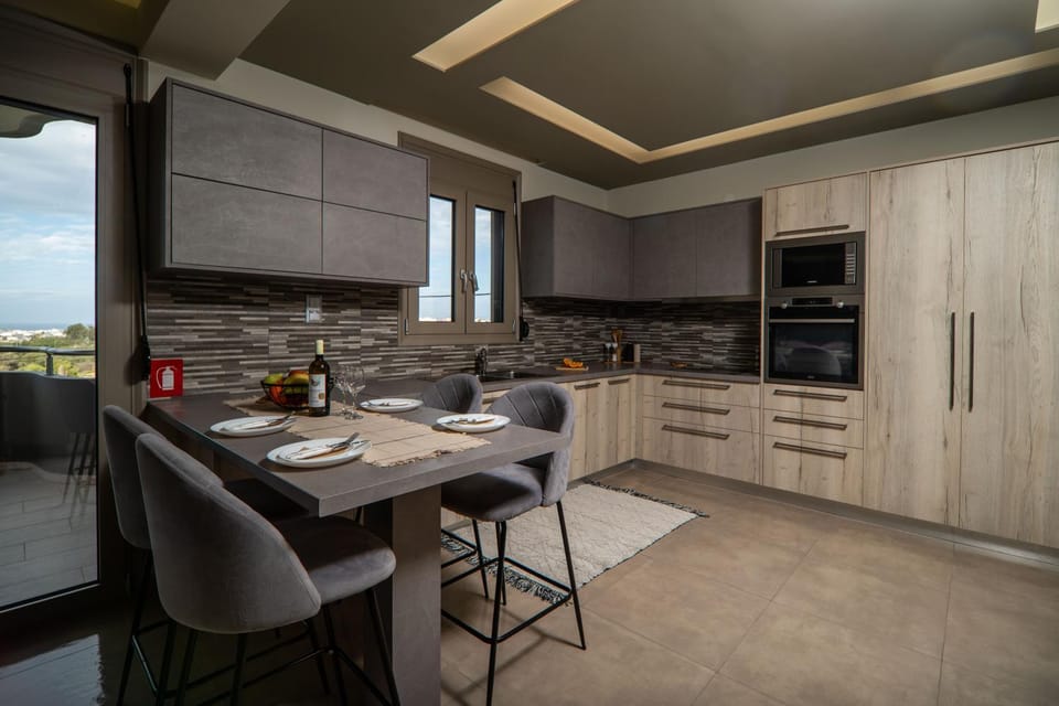 Kitchen or kitchenette, dishwasher, oven, stove