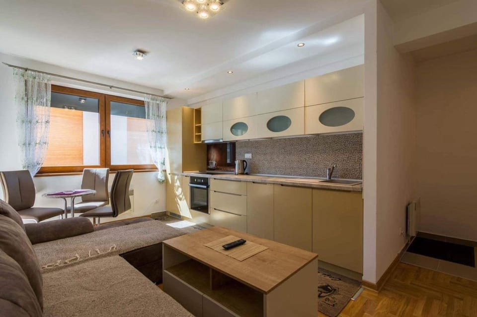 Kitchen or kitchenette, Living room, Seating area, stove