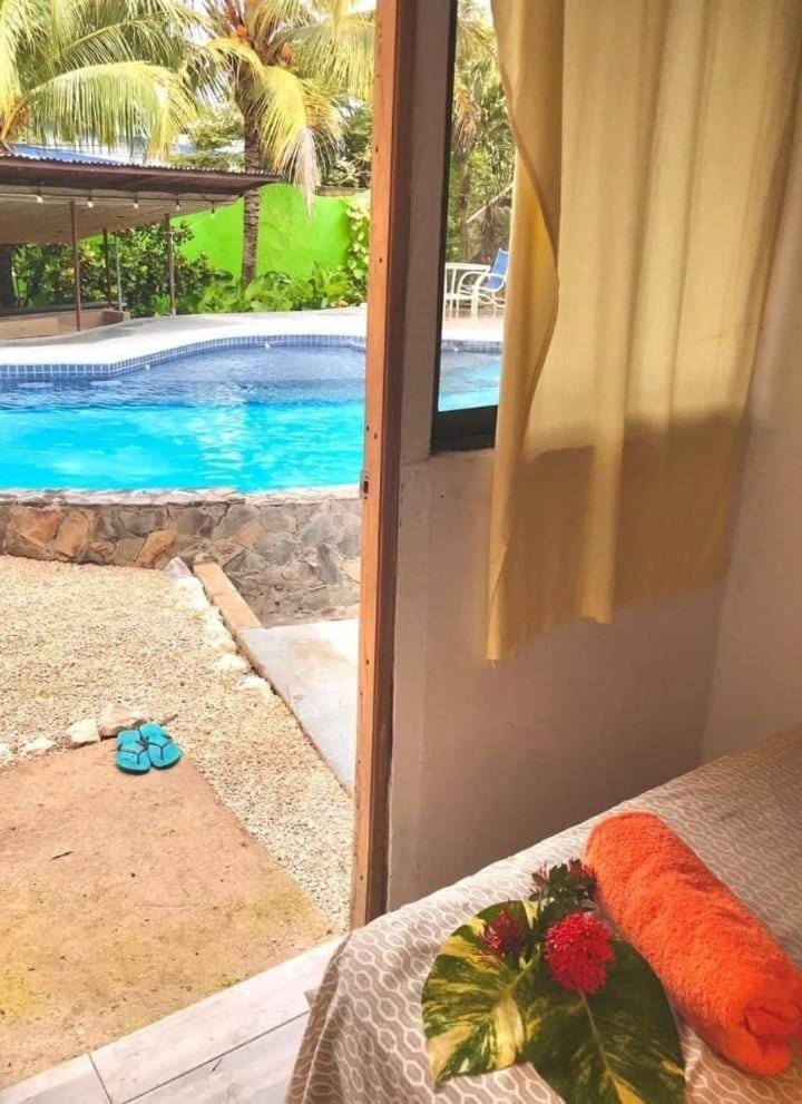 Bed, Bedroom, Pool view, Swimming pool