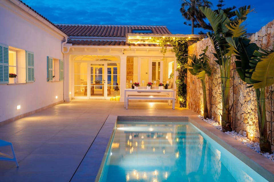 Property building, Patio, Night, Pool view, Swimming pool